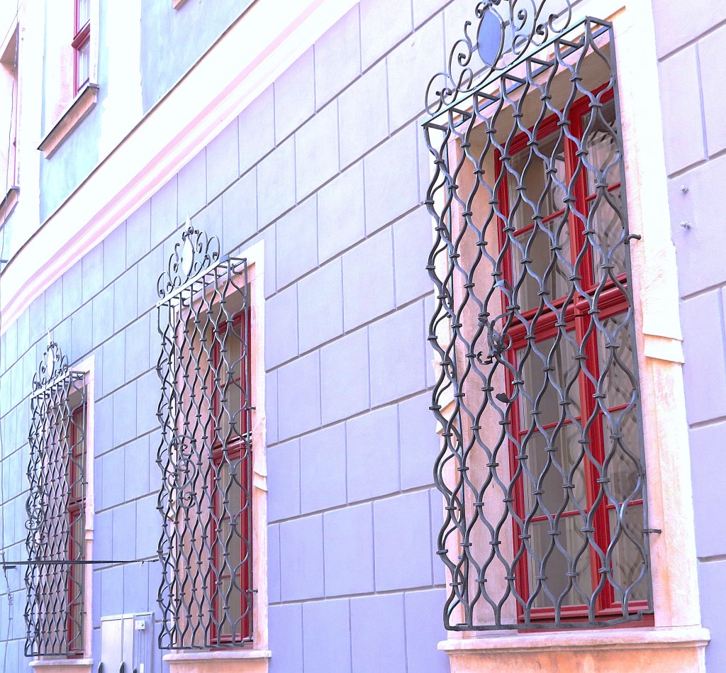 Grilles on arched storefront windows