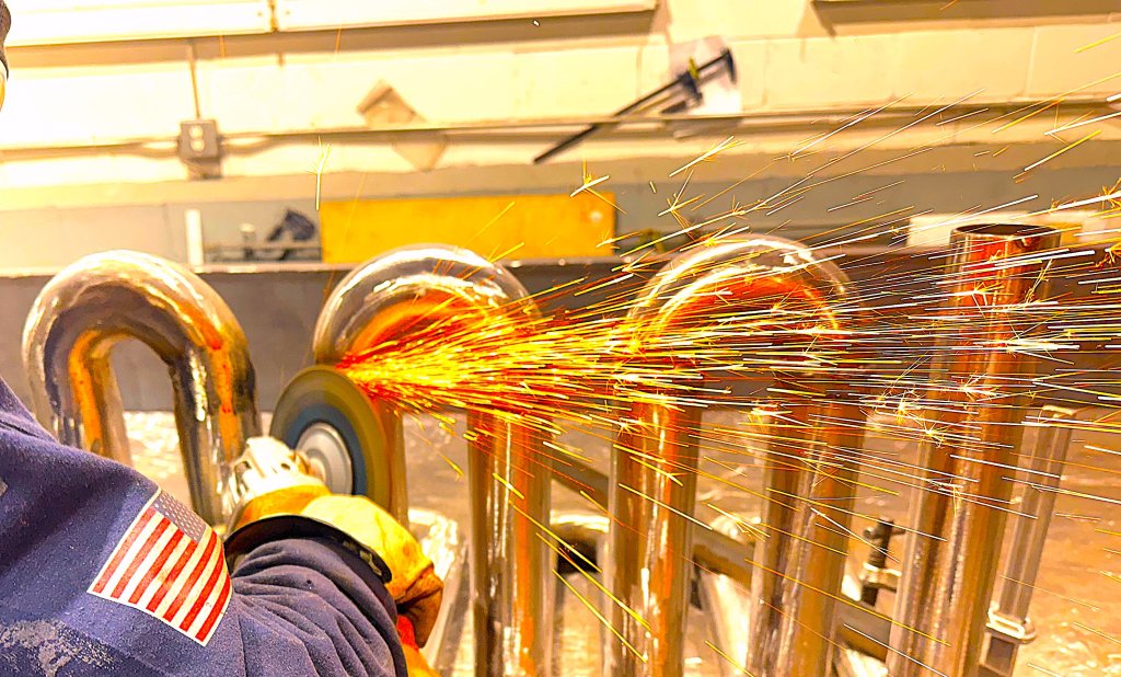 Cutting a bent tube run in the workshop