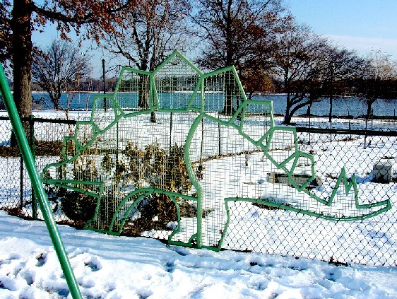 Dinosaur panel set into the park fence