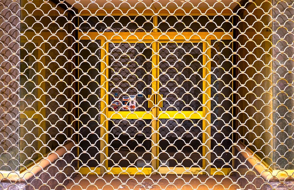 B200B seashell pattern over a lit shopfront