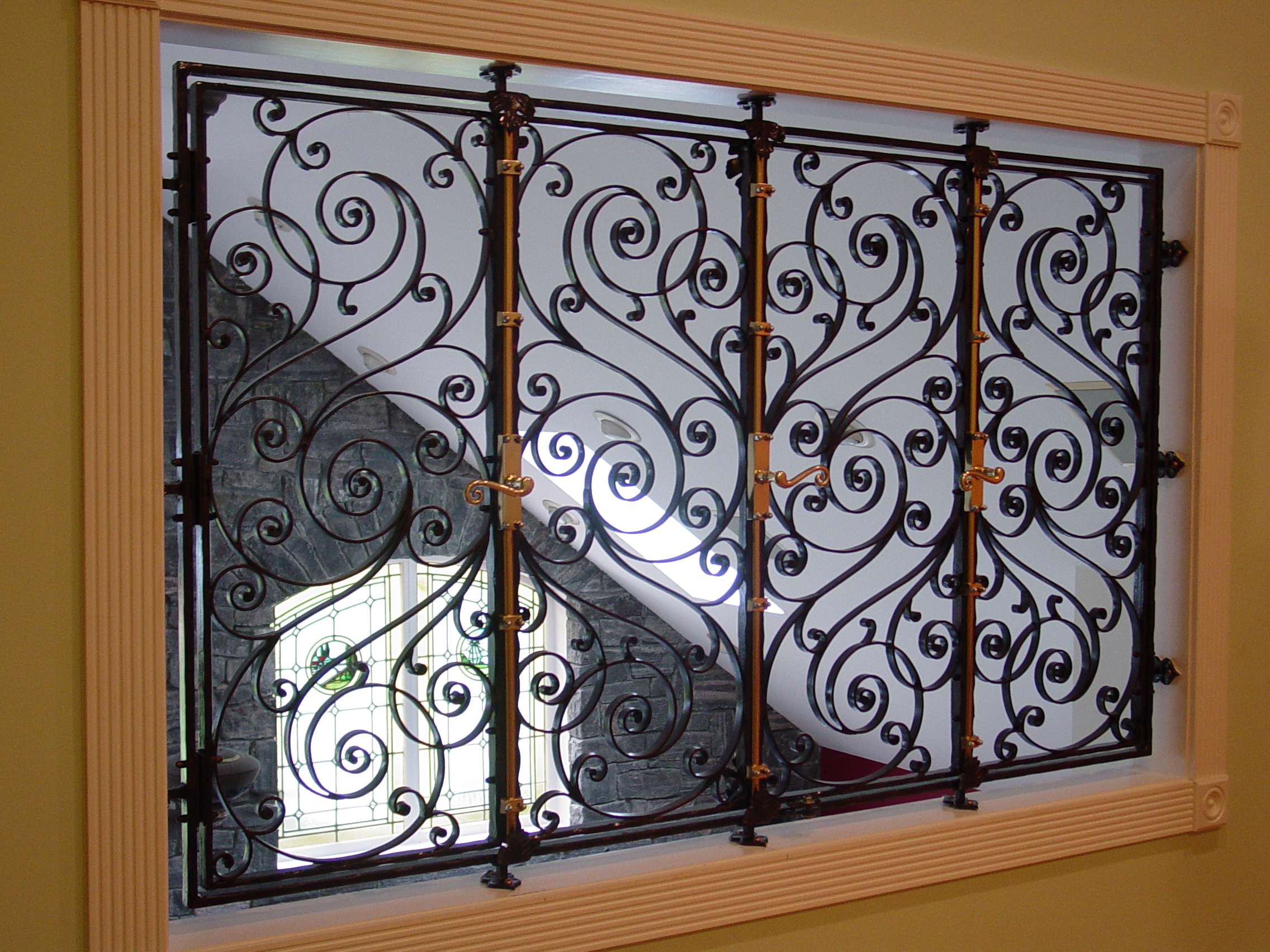 Interior balcony railing with ornamental ironwork