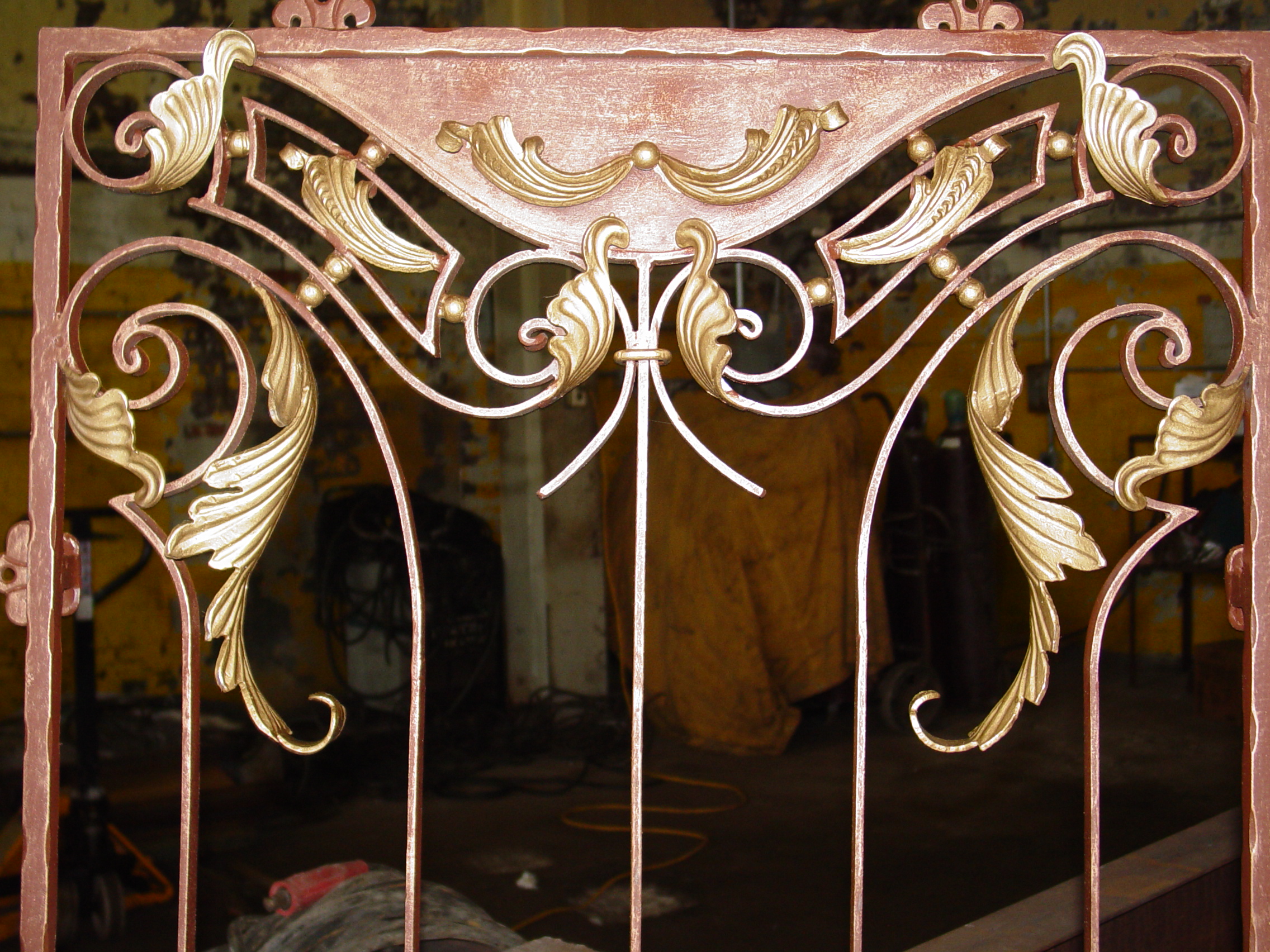 Gilded wrought iron gate with hand-forged acanthus scrollwork