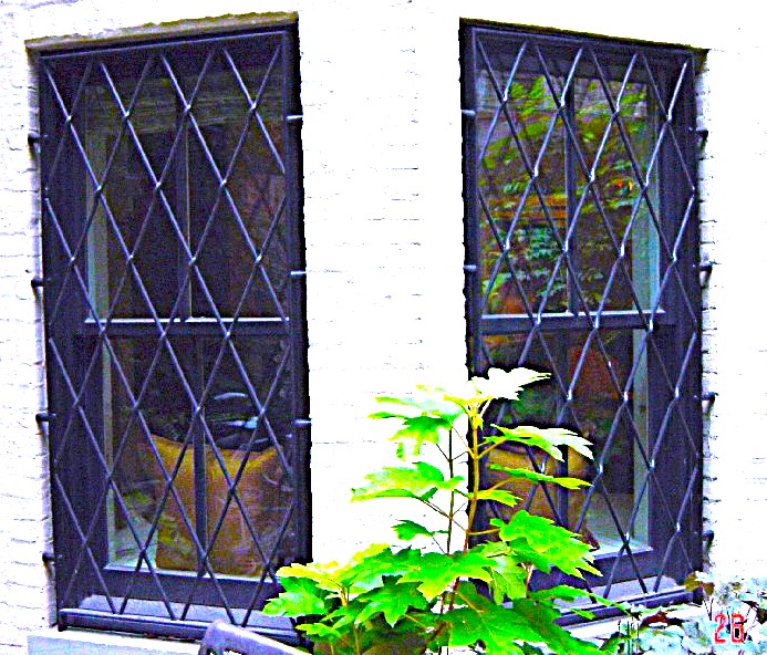 Lattice guards on a pair of casement windows