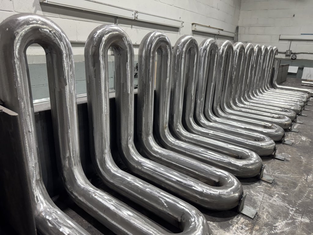 Welded hairpin bends lined up on the bench