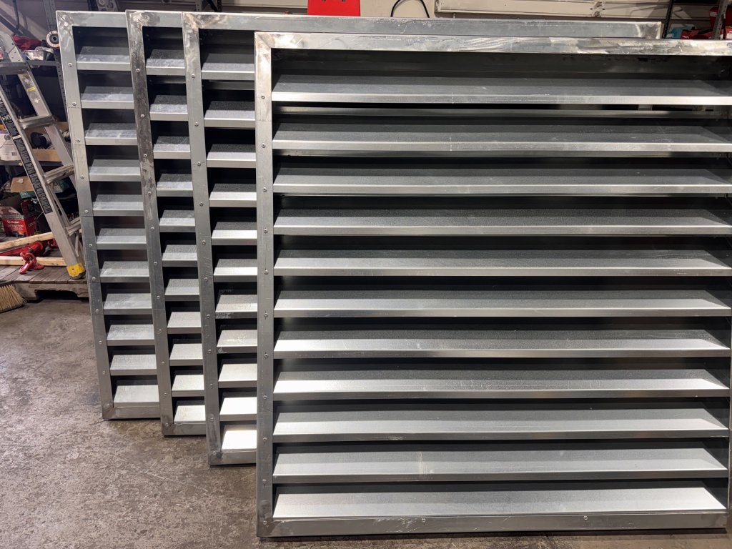 Louvre panels stacked in the workshop